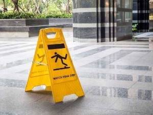 caution sign on the floor of a public space