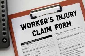 work injury claim form on a clipboard