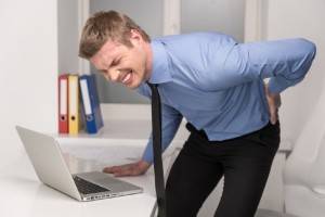 man with lower back pain after a work injury