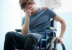 upset man sitting in a wheelchair