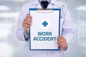 Doctor holding a work accident form