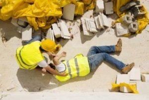 injured construction worker laying on the ground