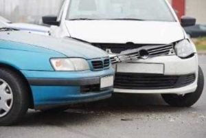 blue and white car involved in a car accident