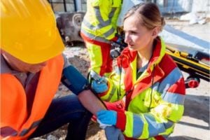 emergency worker caring for an injured worker
