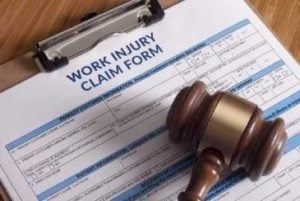 workers' compensation claim form and gavel