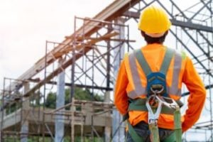 construction worker wearing a safety climbing harness