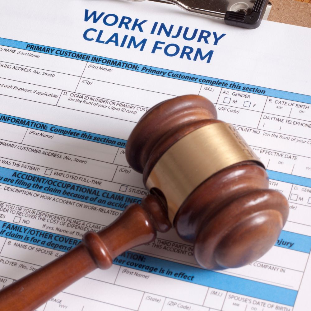 work injury claim form with a gavel on top