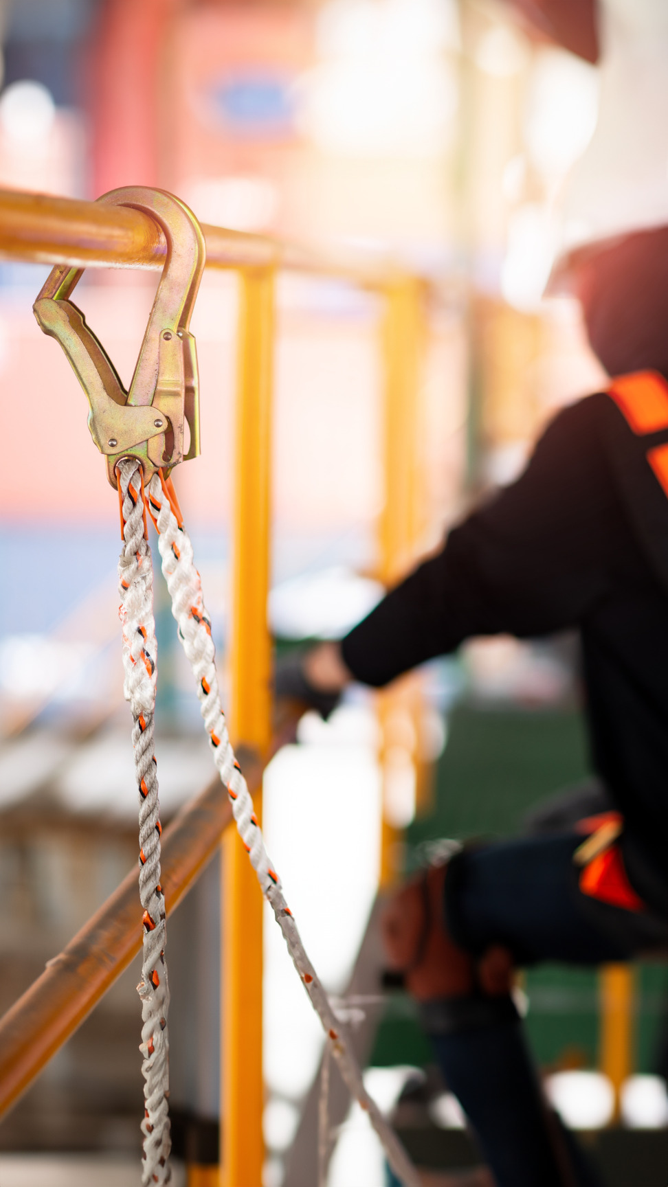 safety climbing harness on a construction worker